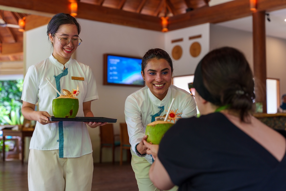 Resort team serving guests at Reethi Faru