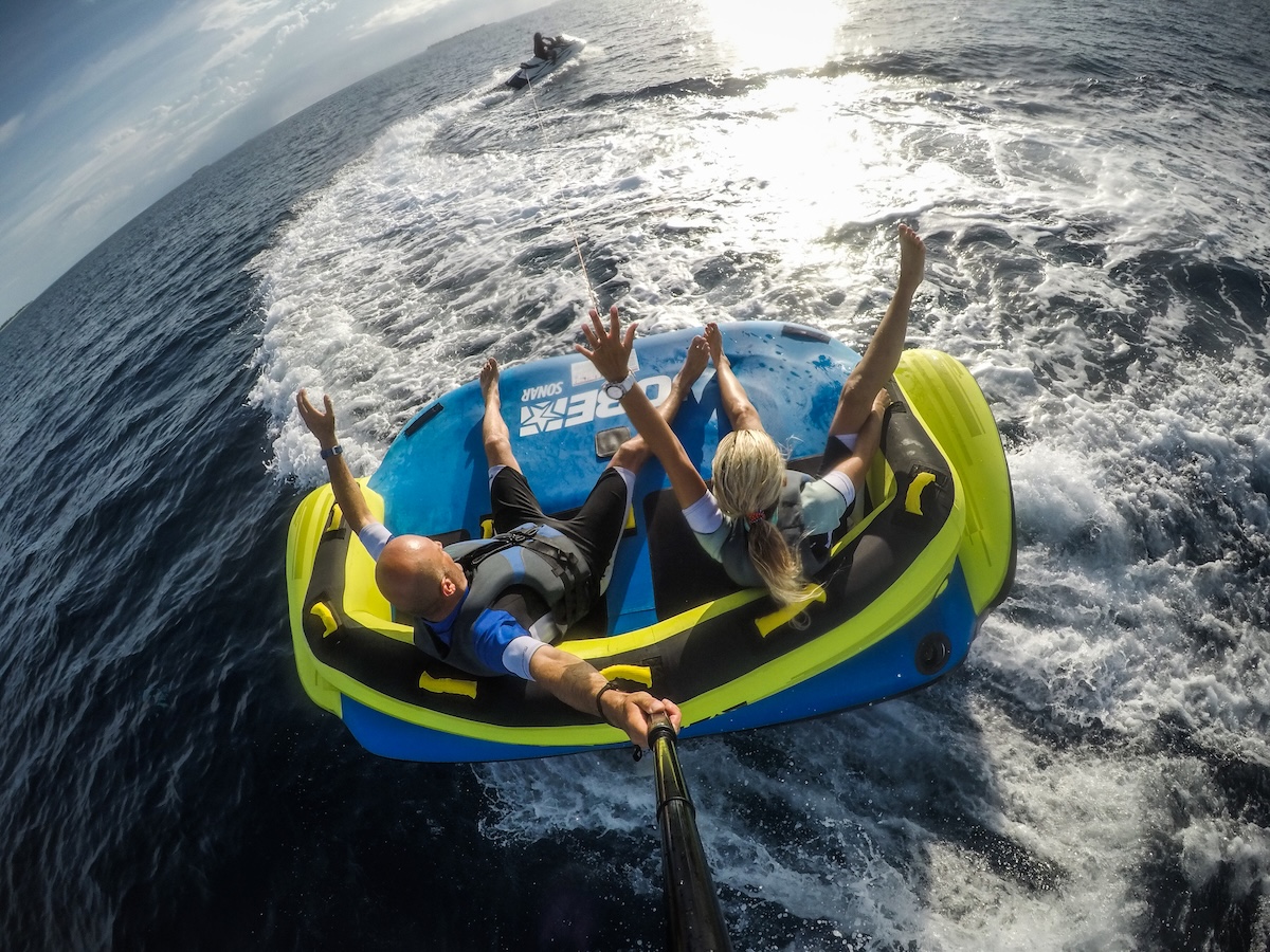 Guests on a towable fun tube