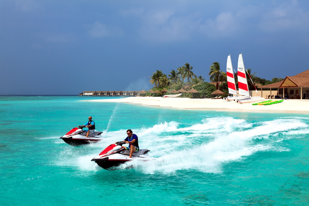 Guests riding jet skis on the lagoon