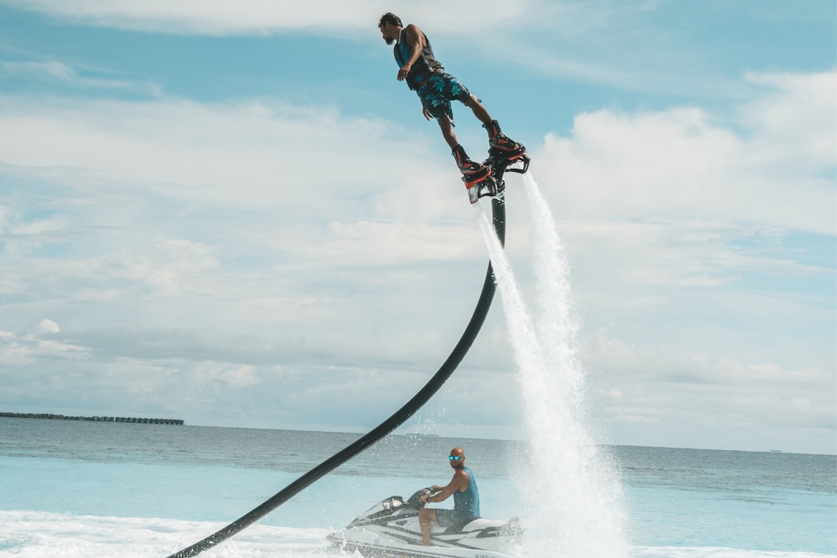 Guest flyboarding above the sea