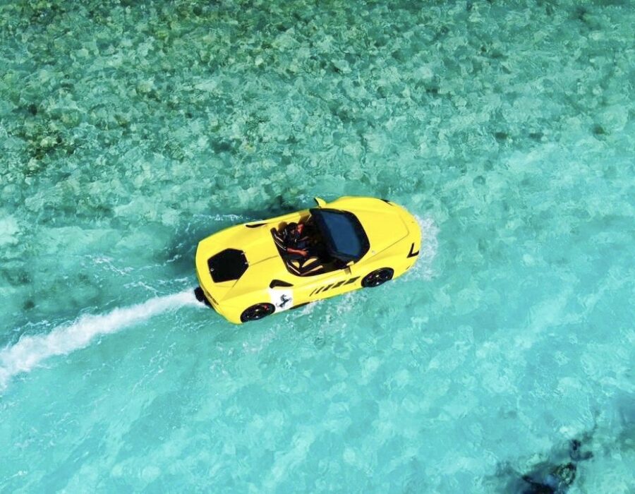 Yellow Jet Car travelling over clear Maldivian water